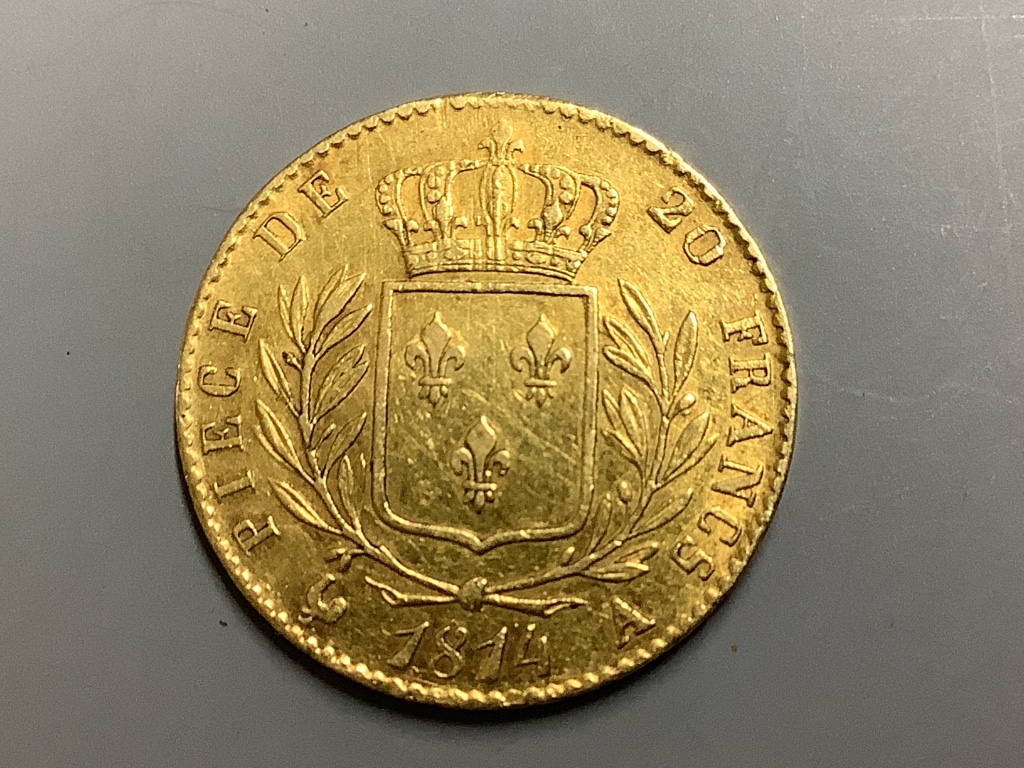 A French 20 Franc gold coin, 1814, Louis XVIII bare head to obverse, crowned wreath to reverse